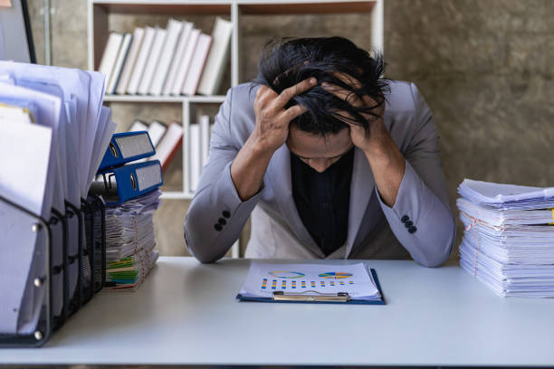 istock Young African man working with analyst sitting in beautiful workplace with computer, laptop and documents, checking financial reports. 1788759568