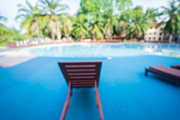 istock Blur chairs at the swimming pool in the morning. 1788761105