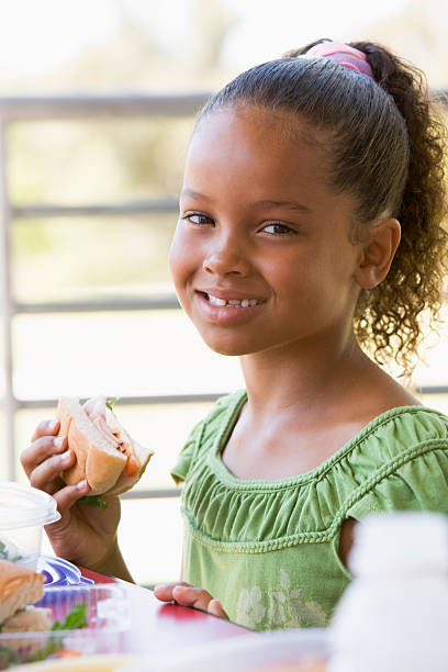istock Girl eating lunch at kindergarten 178876387