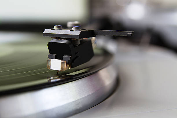 istock Turntable playing vinyl record with music 178876936