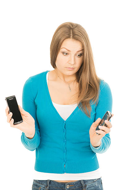 istock Beautiful woman with two phones 178876994
