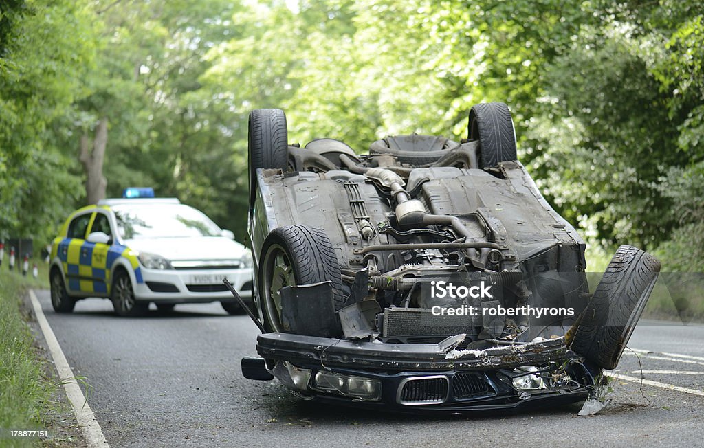 upside down car Car accident crash flipped upside down, road closed by police Car Stock Photo