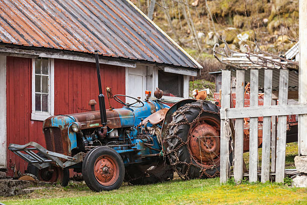 istock Old farm tractor stands in Norwegian village 178877562