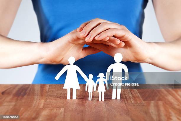 Protecting A Family Stock Photo - Download Image Now - Begging - Social Issue, Adult, Assistance