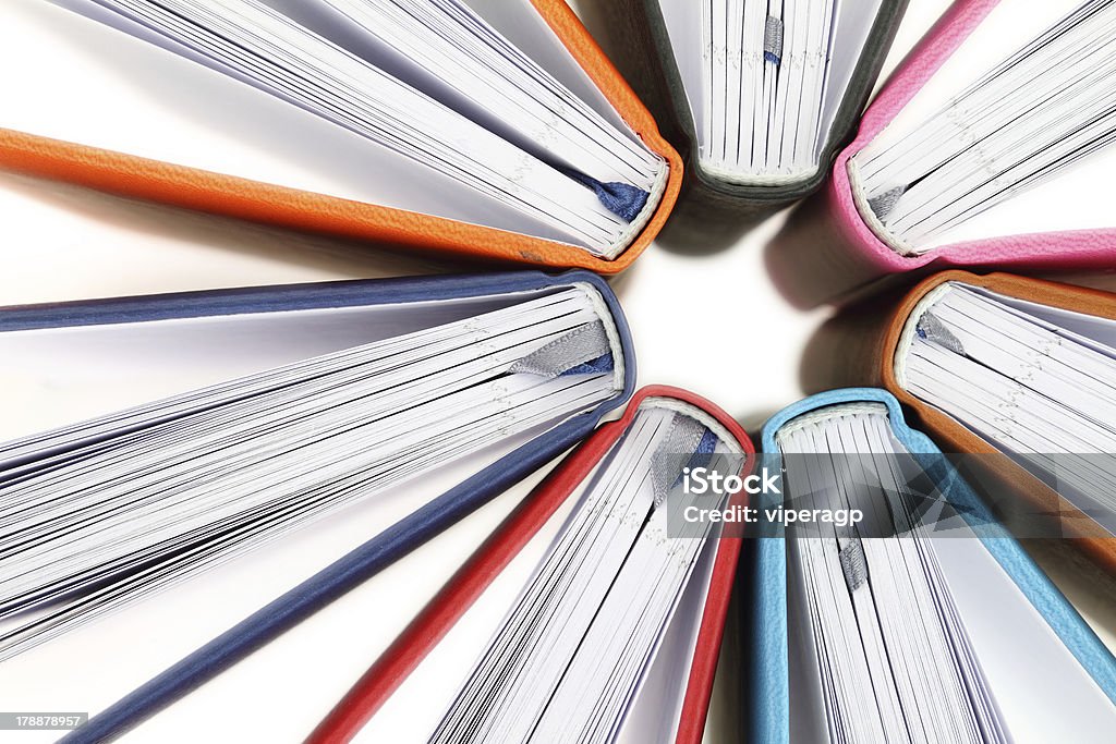 Top view of colorful books in a circle Top view of colorful books in a circle on white background Book Stock Photo