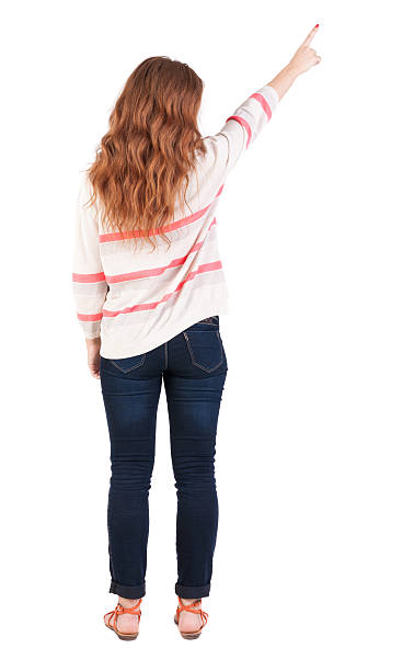 istock Back view of  pointing woman. 178878973
