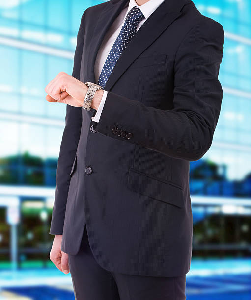 istock Businessman checking time on his wristwatch. 178879078