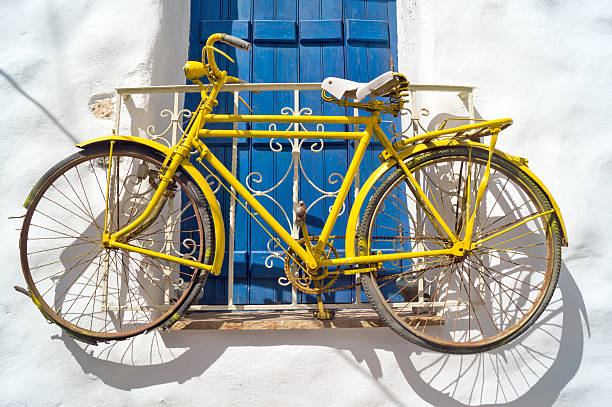 istock Decorative bicycle hanging from window on Naxos island 178879219