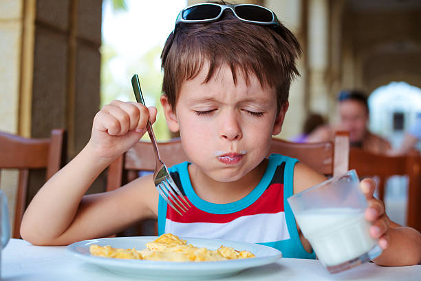 istock Cute little boy having delicious breakfast 178879353