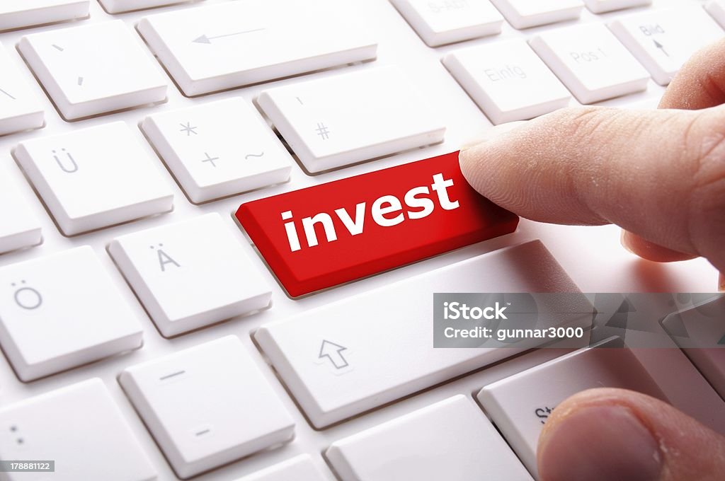 invest invest or investment key or button in red showing business success Bank - Financial Building Stock Photo