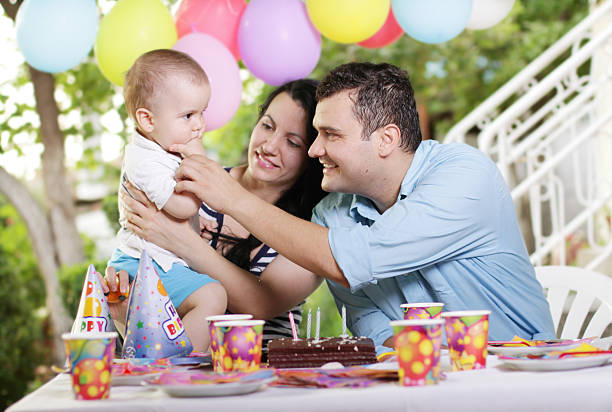 istock Father feeding child with birthday cake 178881911