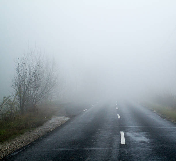 istock Asphalt road in an autumn fog 178882623