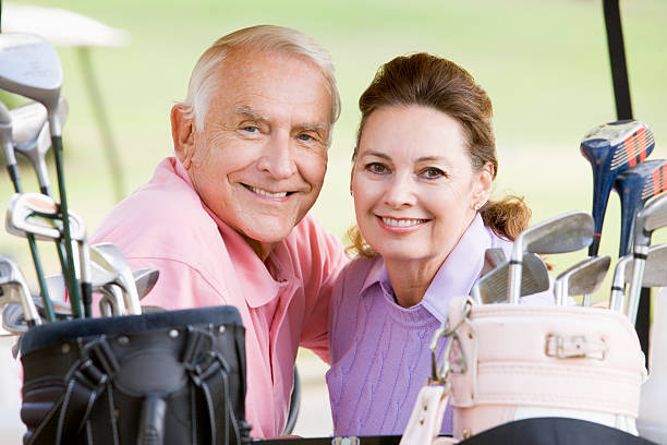 istock Couple Enjoying A Game Of Golf 178884396