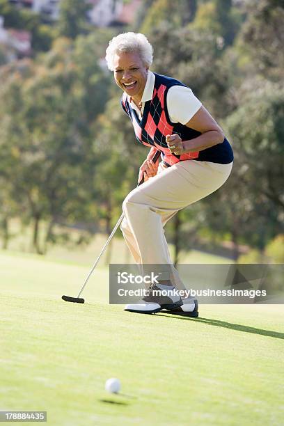 A Woman Playing A Game Of Golf Stock Photo - Download Image Now - Golf, Senior Adult, African Ethnicity