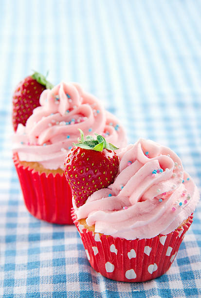 istock Pink cupcakes on a vintage blue retro towel 178885126