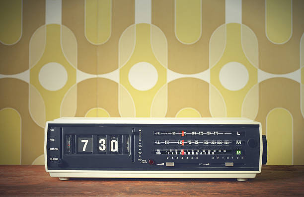 Retro alarm clock on night table.
