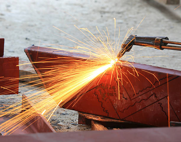 Steel plate cutting by gas machine Steel plate cutting by gas machine oxyacetylene stock pictures, royalty-free photos & images