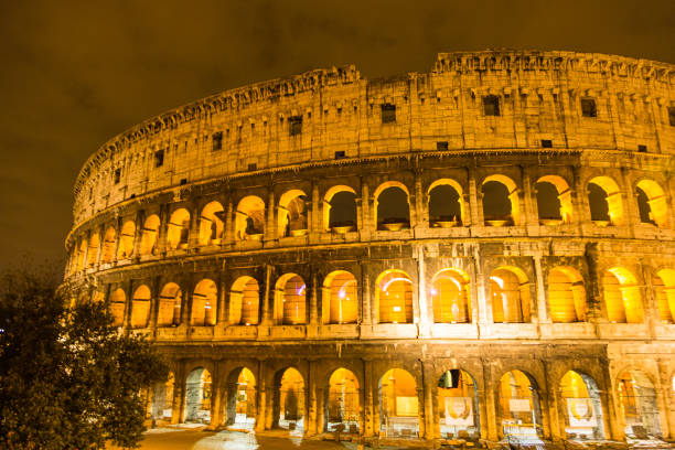 rome, italy, colosseum old ancient building gladiator battle at night
