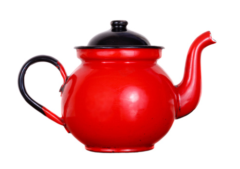 Red pot of tea isolated on white background