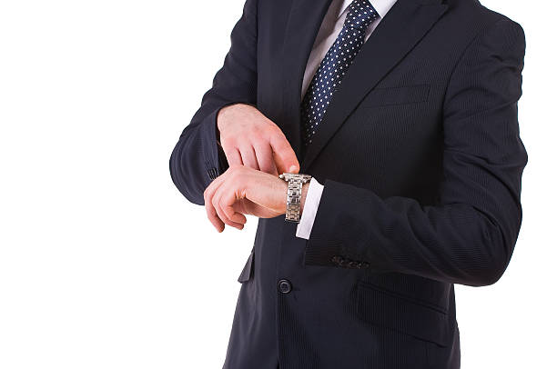 istock Businessman pointing at his wristwatch. 178888150