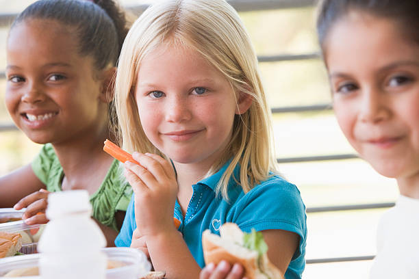 istock Young children eating lunch with friends 178888566