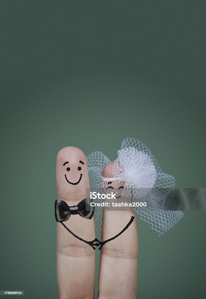 bride and groom fingers Two happy fingers decorated as bride and groom with veil and bow tie Adult Stock Photo