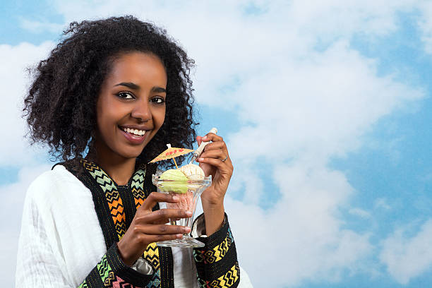 icecream アフリカの少女 - women eating ice cream indigenous culture ストックフォトと画像