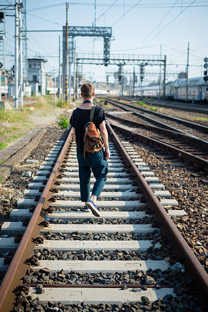 istock hipster modern stylish blonde man on rails 178889317
