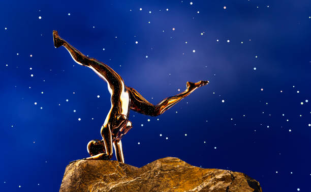 istock A female Afro robot performs yoga alone on a rock under the starry sky. 1788897322