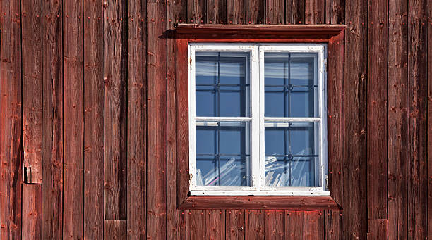 istock Texture of a window on the old red wooden wall 178890599
