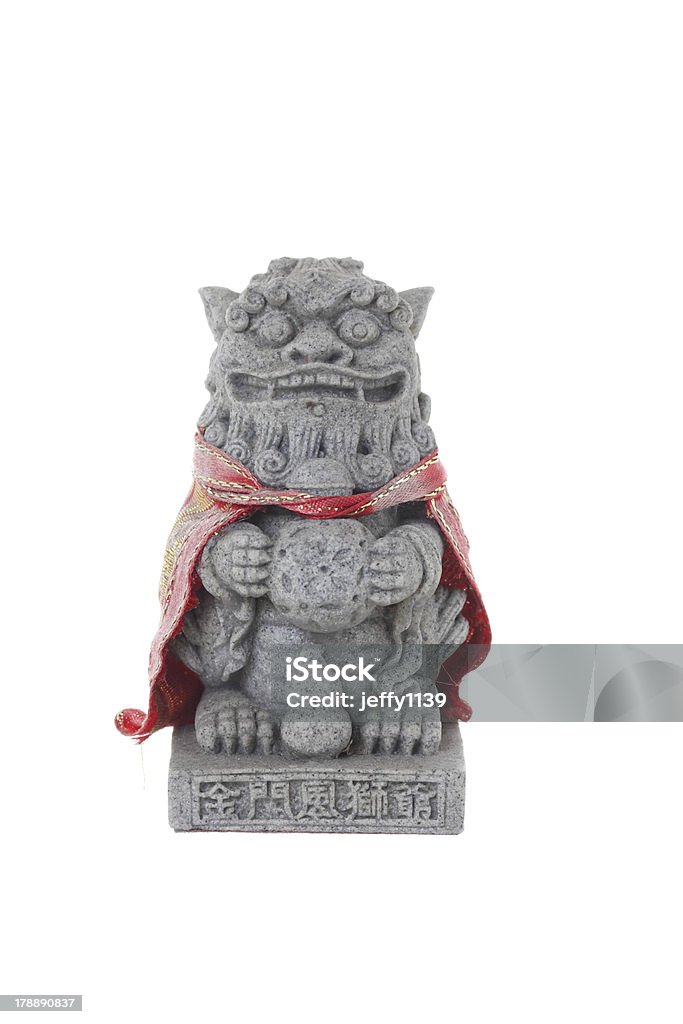 Chinese Imperial Lion Statue, Isolated on white background Ancient Stock Photo