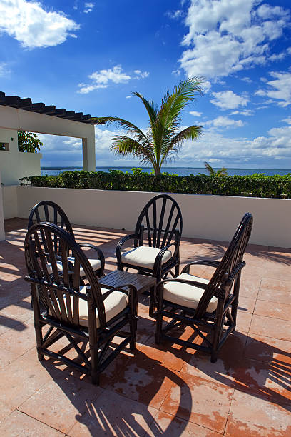 istock Chairs and little table on  tropical terrace overlooking the sea 178891175