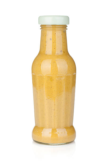 горчица стеклянной бутылка - yellow mustard mustard indoors vertical стоковые фото и изображения