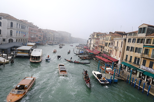 A view of the Grand Canal on a foggy day. Venice, Italy - November 11, 2023.