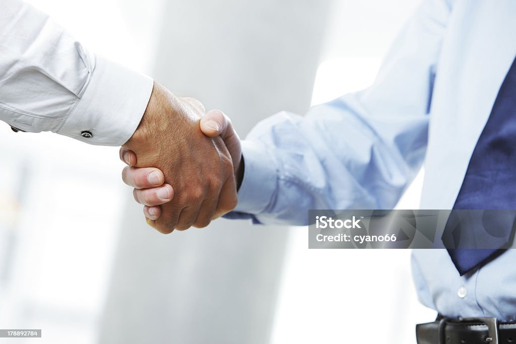Businessmen shaking hands Business deal. Close up of a handshake Admiration Stock Photo