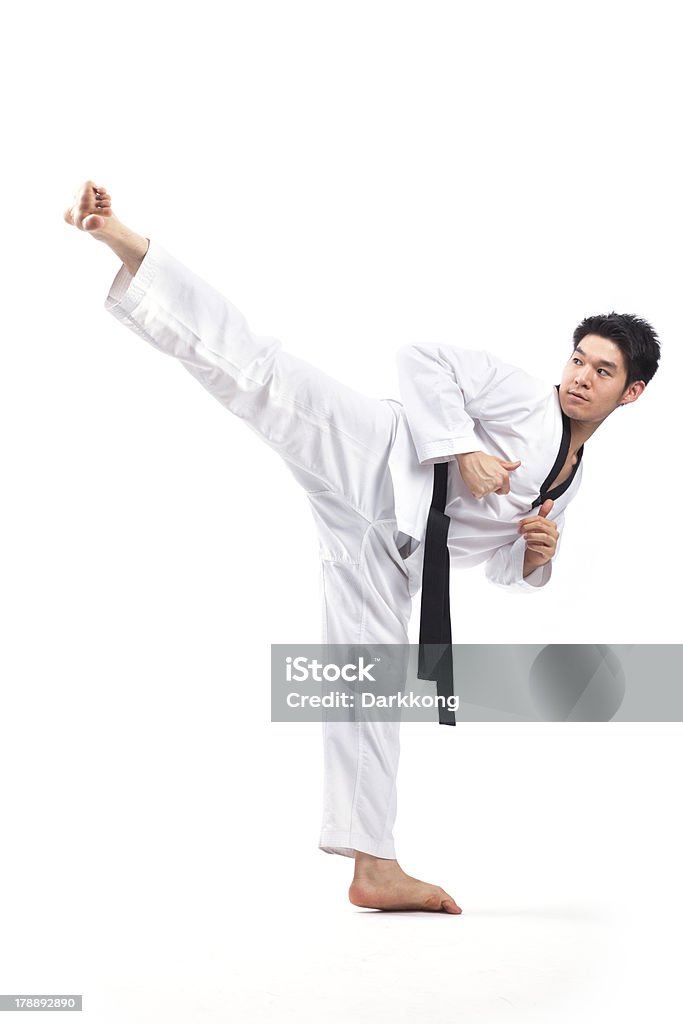 taekwondo action taekwondo action isolated by a young man Active Lifestyle Stock Photo