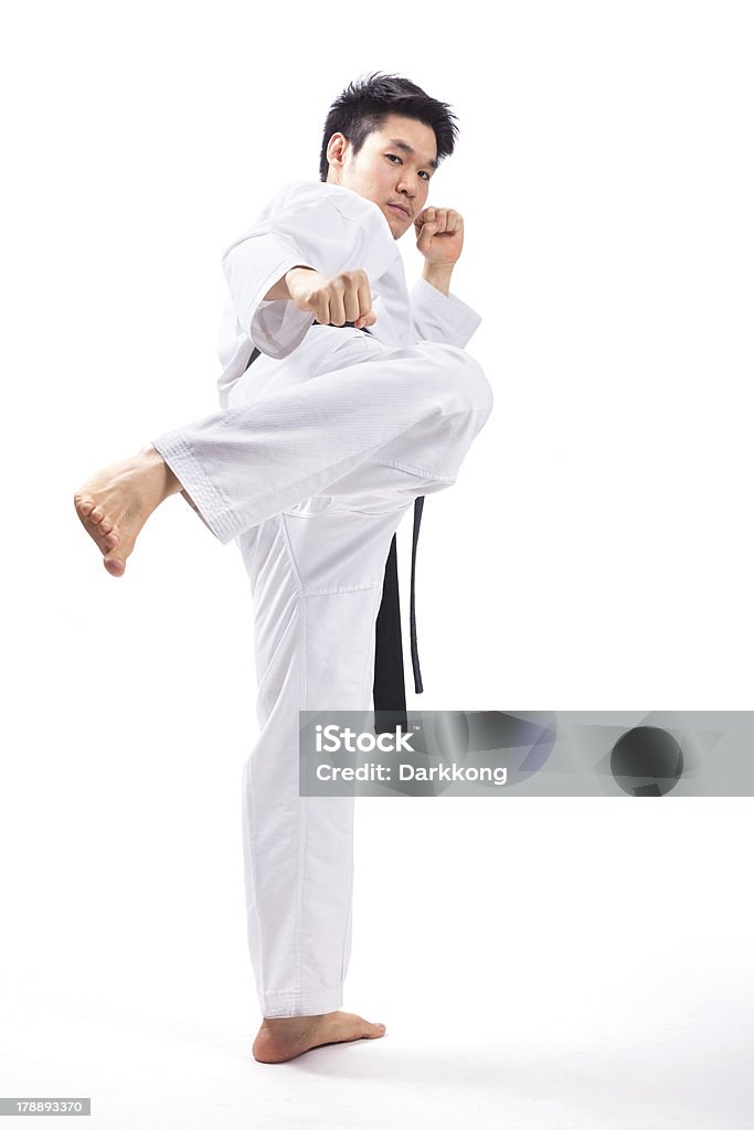 taekwondo action taekwondo action isolated by a young man Active Lifestyle Stock Photo