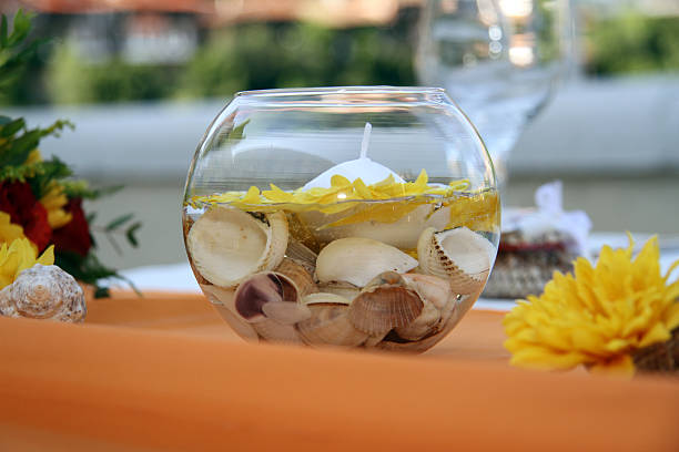 istock Table decoration with flowers, candles and shells 178895348