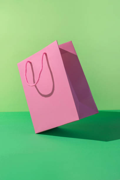 istock Paper shopping bag on green background. 1788958991