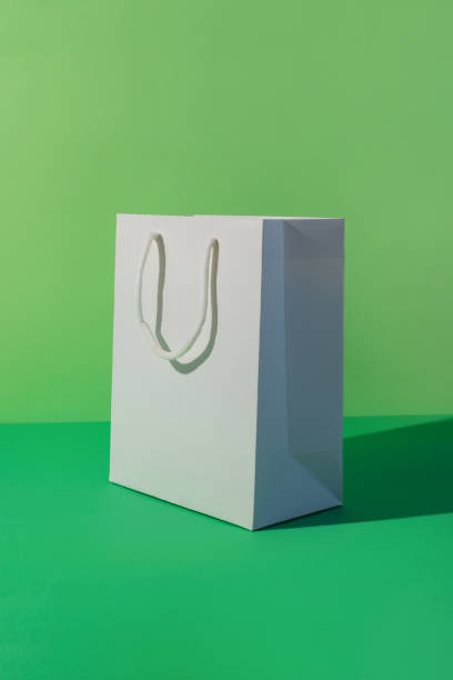 istock Paper shopping bag on green background. 1788960042