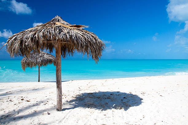 istock Beach Umbrella on white sand in front of Sea 178896030