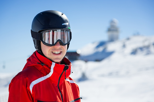 Young skier portrait at Jahorina ski resort, Bosnia and Herzegovina, in winter afternoon.