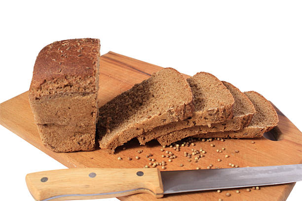 istock Knife, chopped rye bread on a cutting board wooden. 178897871