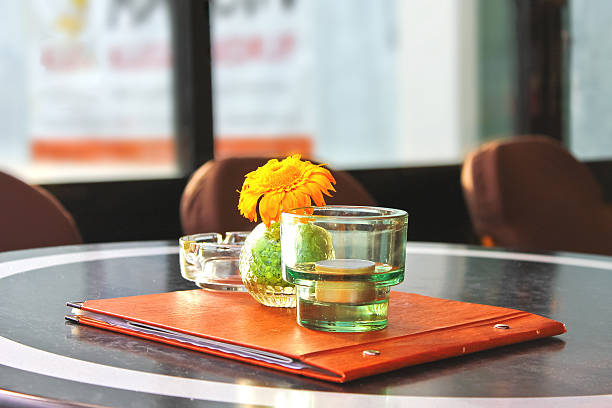 istock Flower,  menu and  candle on  table in  cafe. 178897998