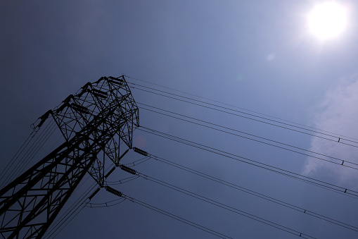 High voltage overhead power lines - stock photo