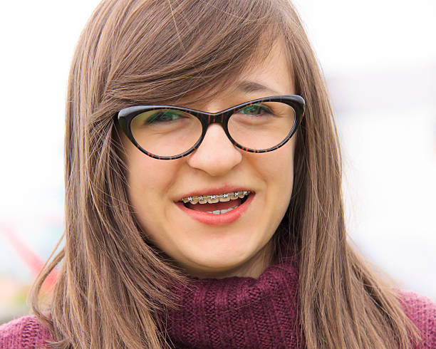 istock smiling young teenager with braces 178898496