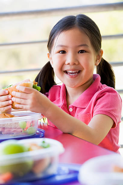 istock Girl eating lunch at kindergarten 178898914