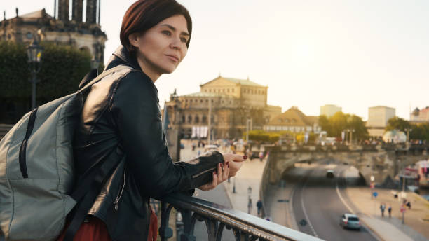 istock Young Woman Admires City View 1788991280