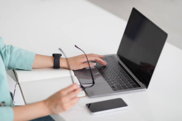 istock Millennial caucasian woman boss in suit typing on computer with empty screen at workplace 1788992365