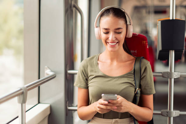 istock Lady Using Cellphone And Listens Music While Sitting In Tram 1788996894